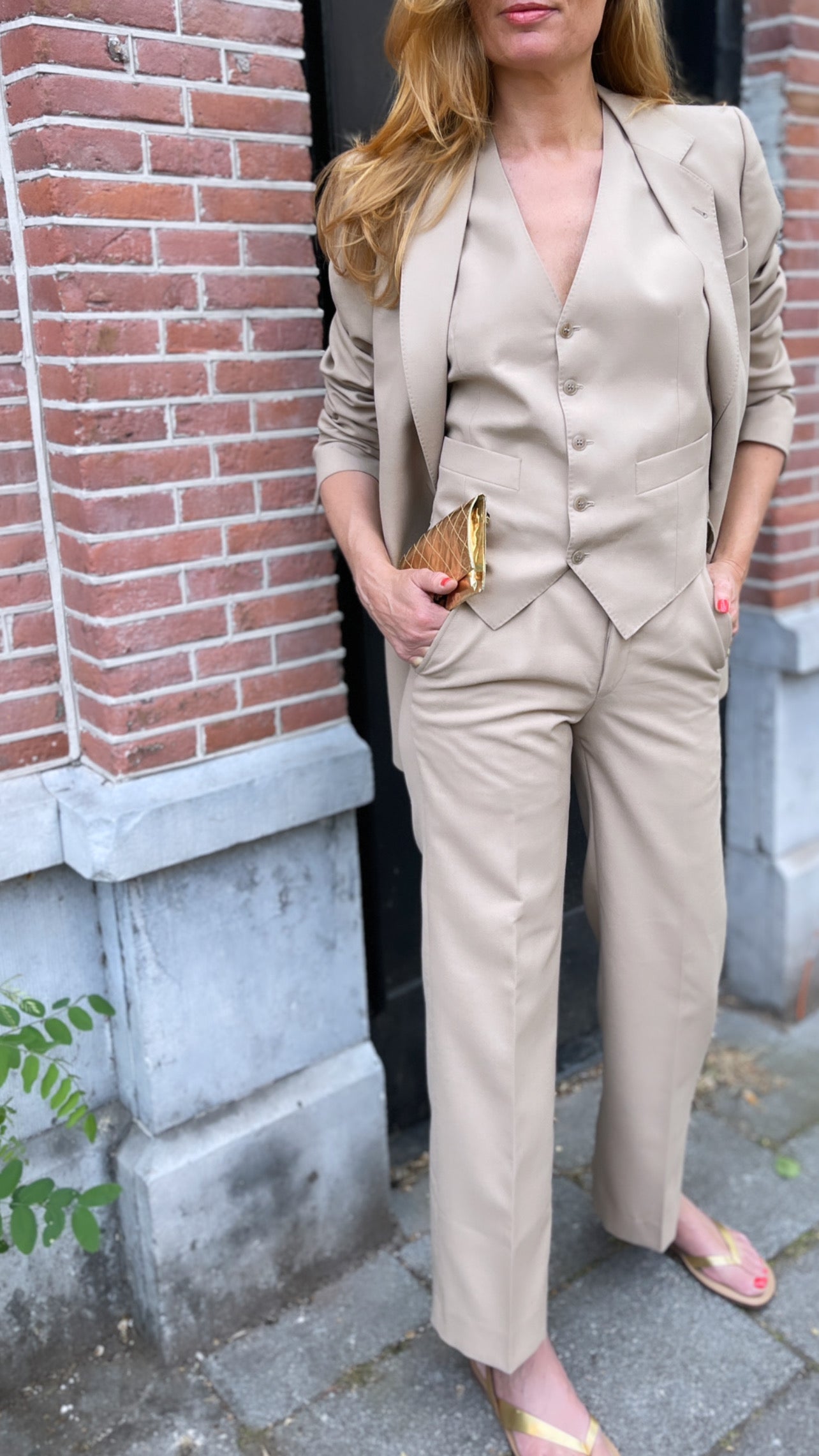 Three pieces beige suit.