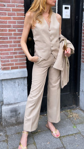 Three pieces beige suit.