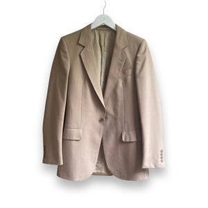 Three pieces beige suit.