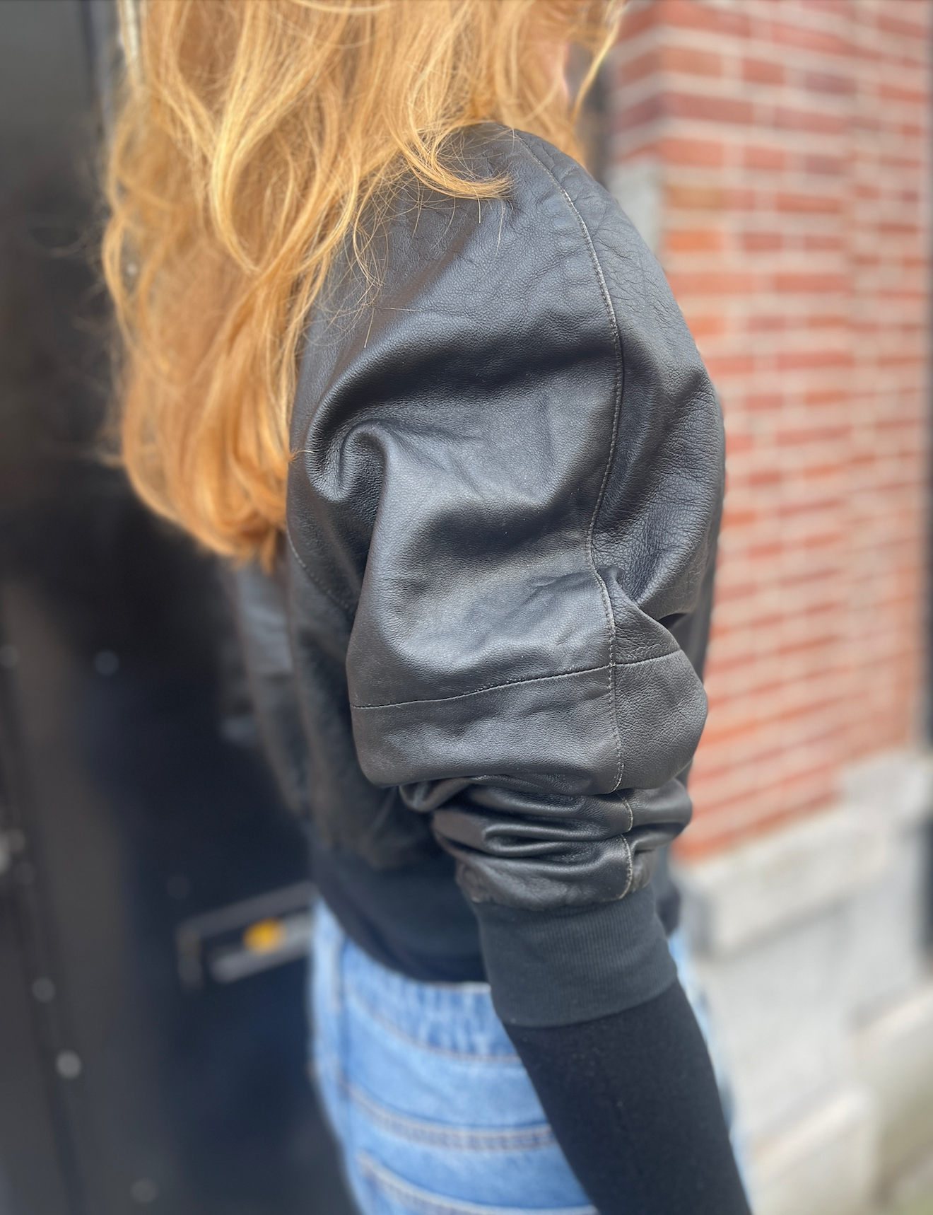 cropped black leather bomber.