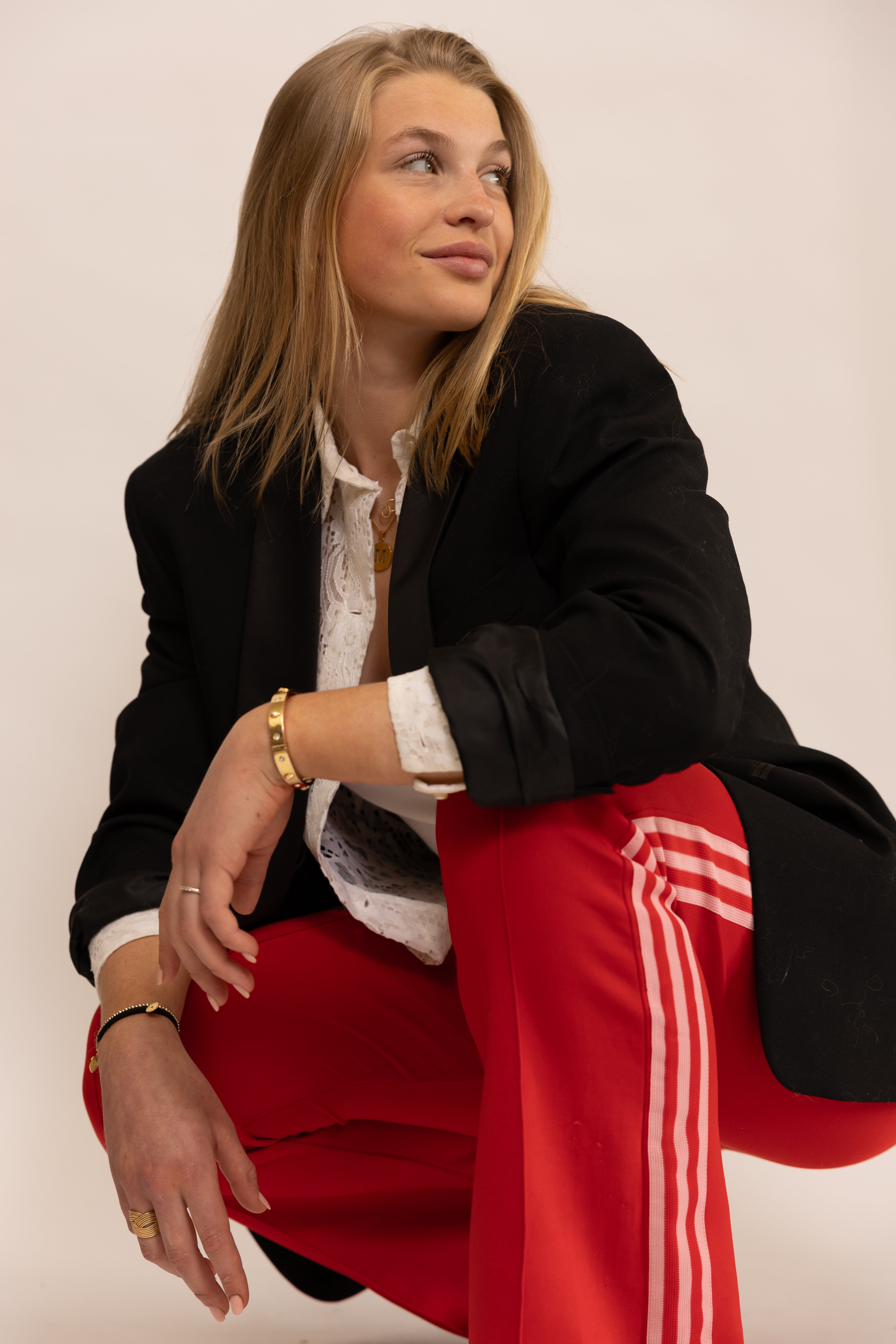Fire red adidas track pants.