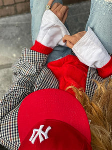 Bright red sweater by Luisa Cerano.