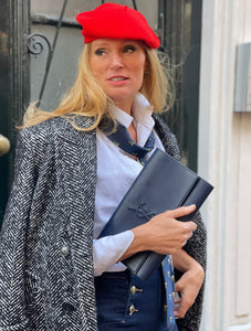 "Belle du jour" navy clutch by Yves Saint Laurent.