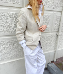 Cream tweed blazer.