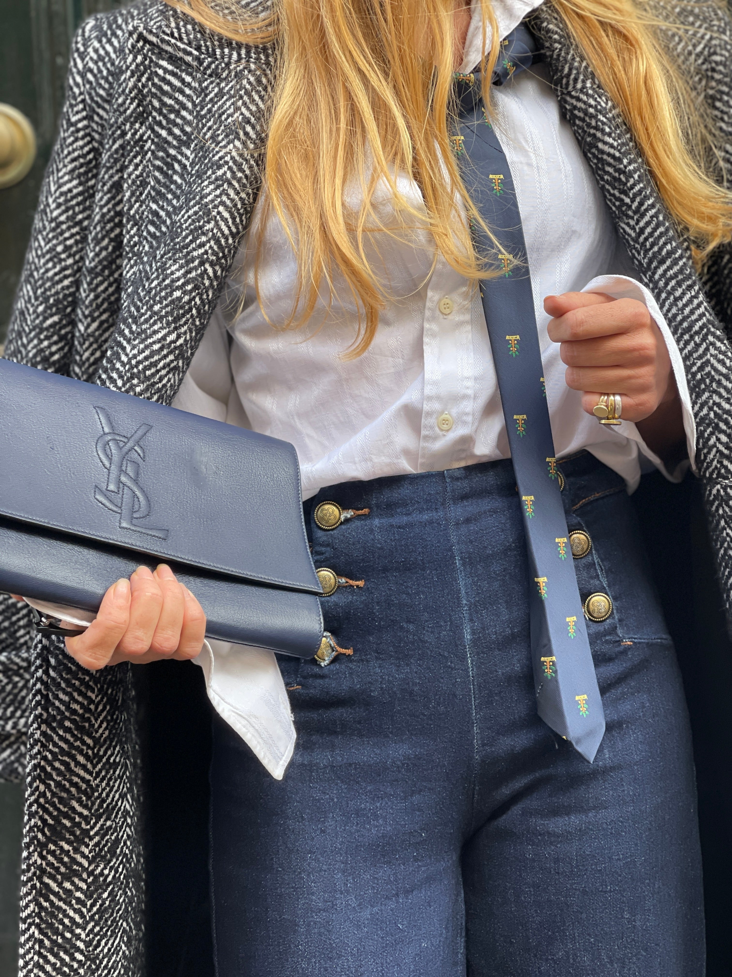 "Belle du jour" navy clutch by Yves Saint Laurent.