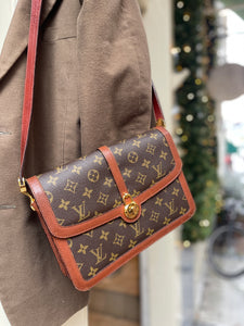 Cross body monogram bag by Louis Vuitton.