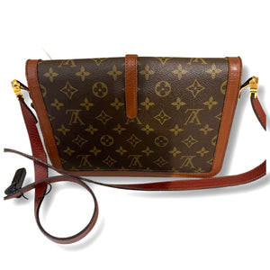 Cross body monogram bag by Louis Vuitton.