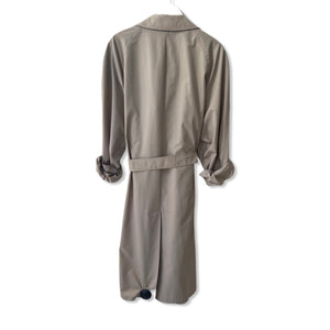 Sand colour belted Burberry trench coat.
