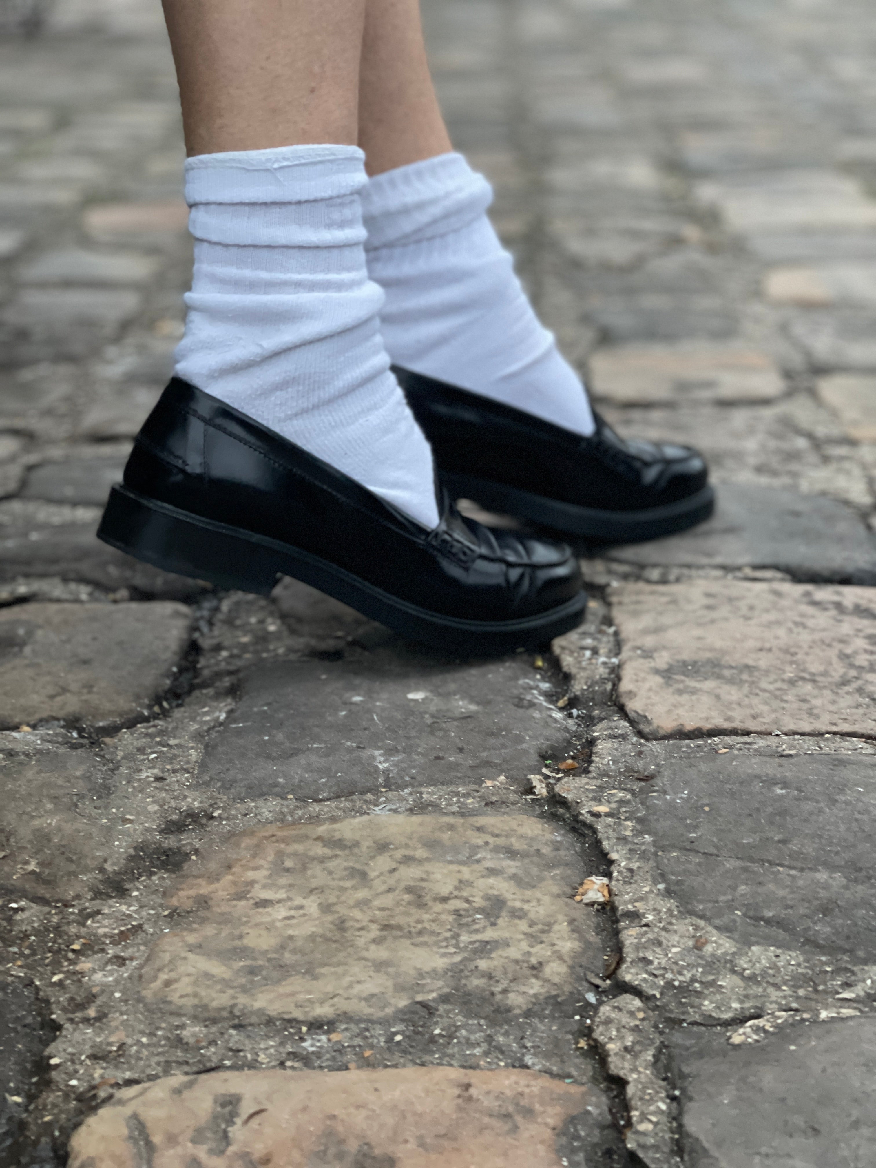 Black loafers by Tod's.