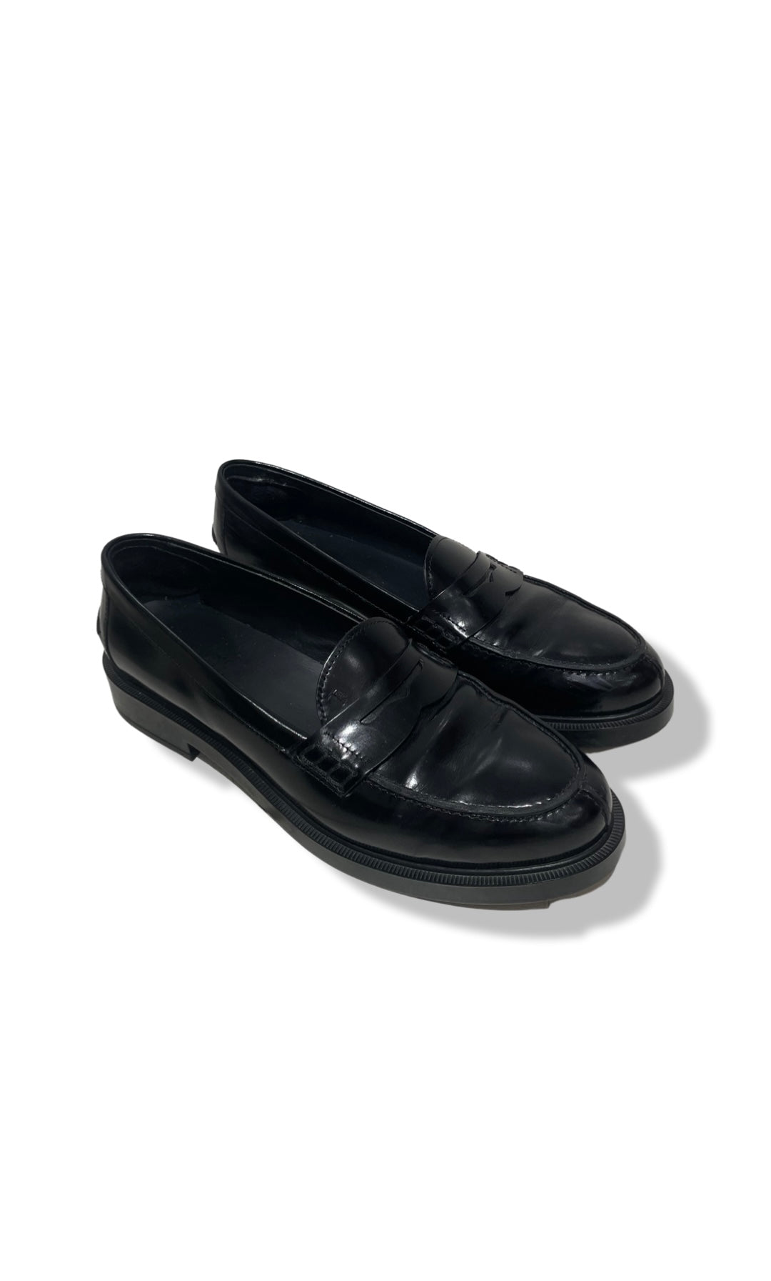 Black loafers by Tod's.