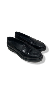 Black loafers by Tod's.